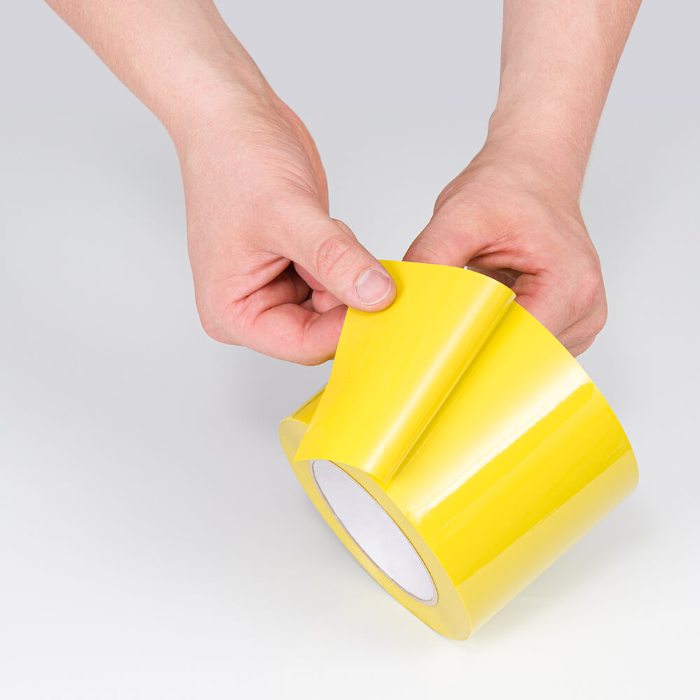 yua-markierungsband-standard-plus-gelb-klebend-10-cm-33-m-rolle-praxis-klebeseite.jpg